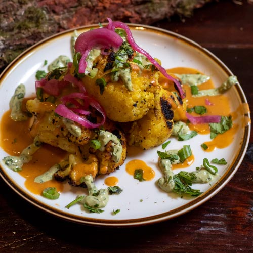 Plated kosher BBQ dish by Izzy's catering